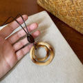 Brown Cord Geometric Pendant Necklaces in Seven Designs view 10