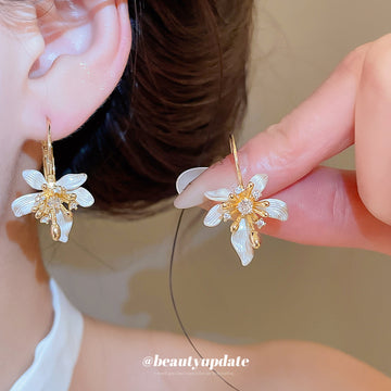 White Floral Hoop Earrings with Gold Tone Leaf Details