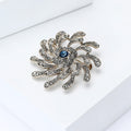 Silver Spiral Flower Brooch Clear Rhinestones Blue Center view 2