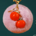Twin Persimmon Plush Pom Keychains in Fifteen Listed Loop Colors view 7