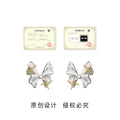 Silver Tone Bow And Gold Tone Star Accent Stud Earrings view 3