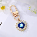 Gold Tone Crystal Heart and Sun Evil Eye Clip Keychains view 6