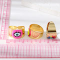 Gold Tone Wide Cuff Smiley and Lash Eye Adjustable Rings view 4