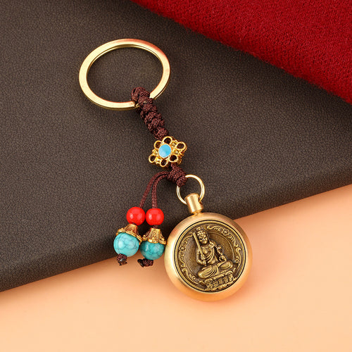Brass Rotating Guardian Deity Keychain with Green Bead Cord