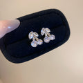 Silver Crystal Bow Stud Earrings in Two Pictured Bow Shapes view 6