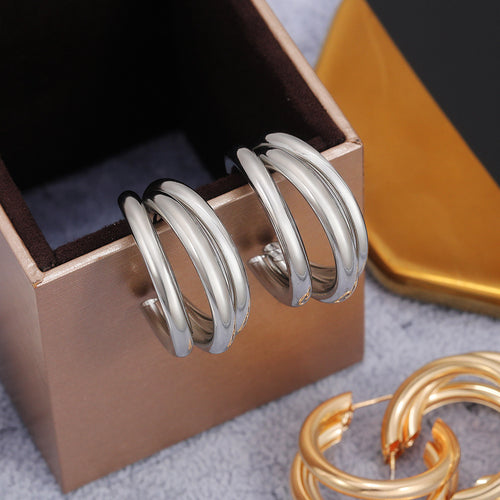 Triple Hoop Earrings In Gold Silver And Rose Gold Tones - angled detail view