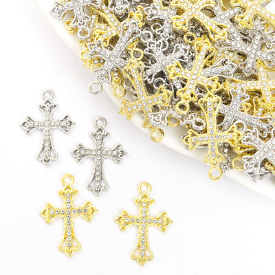 Front assortment of ornate crosses with clear crystal details and curled ends