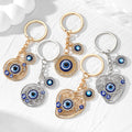 Gold and Silver Tone Openwork Heart and Round Evil Eye Keychains view 1