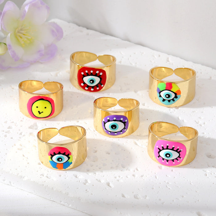 Gold Tone Wide Cuff Smiley and Lash Eye Adjustable Rings