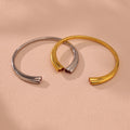 Open Cuff Bracelet With Heart Ends In Gold And Steel Tone view 2