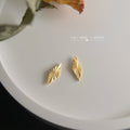 Gold Rhombus Diamond Stud Earrings Sunburst Cut Facets view 3