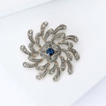 Silver Spiral Flower Brooch Clear Rhinestones Blue Center view 3