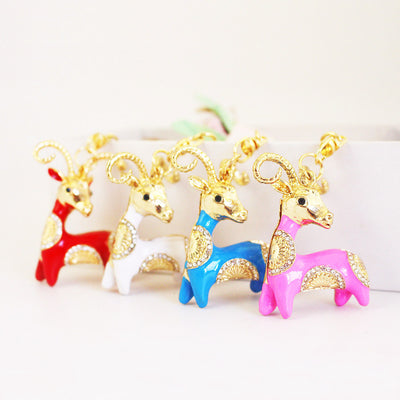 Four ram keychains in red, white, blue, and pink stand together.