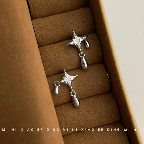 Silver-tone four-point-star clear-stone teardrop studs in the first product display.