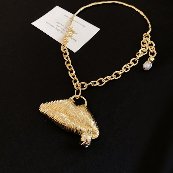 Sculpted Lips Pendant Necklaces in Three Metallic Finishes