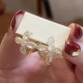 Gold Tone Crystal Flower Huggie Earrings with Layered Petals view 2