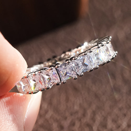 Product view showing silver-tone shape-cut clear-stone eternity band