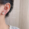 White Pearlized Rose Flower Stud Earrings Carved Bloom Design view 2
