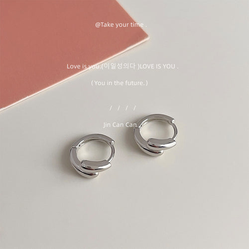 Silver-tone double-layer teardrop huggie hoops in the first product display.