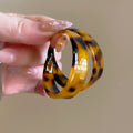 Wide Tortoiseshell Resin Hoop Earrings with Polished Details view 2