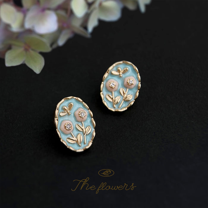 Gold Tone Pale Blue Enamel Flower And Leaf Oval Stud Earrings