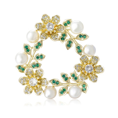 Front product view of the floral wreath brooch on a light background