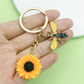 Bee and Honeycomb Charm Keychains Featuring Bee Across 25 Pictured Variations view 1
