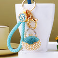 Round Pearl Handbag Keychains with Fortune Braided and Plain Loop Options view 1