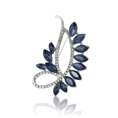 A curved spray of navy marquise leaves and clear crystals shown on a white background.