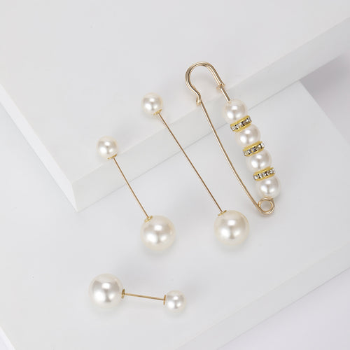 Pearl safety pin and stick pins angled on stepped display