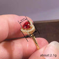 Red Heart-Shaped Solitaire Halo Ring In Polished Gold Tone view 4