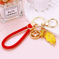 Yellow Leaf and Coin Charm Keychains with Fifteen Braided Strap Options view 4