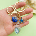 Starfish, Conch and Shell Charm Keychains Featuring Flower Across 58 Pictured Variations view 2