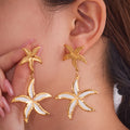 Gold Dual Starfish Drop Earrings with White Enamel Inlay view 2