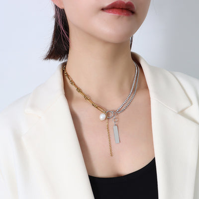 Two-tone paperclip rhinestone pearl bar tag necklace on model