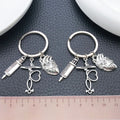 Two Silver Tone Syringe Stethoscope and Heart Keychains view 2