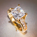 Square Clear Solitaire Channel Band Ring In Polished Gold Tone view 2