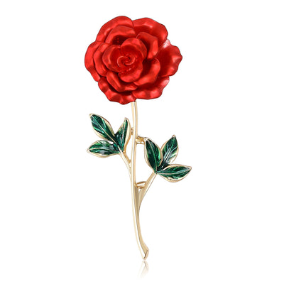 Front view of the red rose stem brooch showing a glossy red rose on a gold-tone stem with green leaves