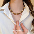 Brown Translucent Oval Bead Necklace Gold Metal Accents view 1