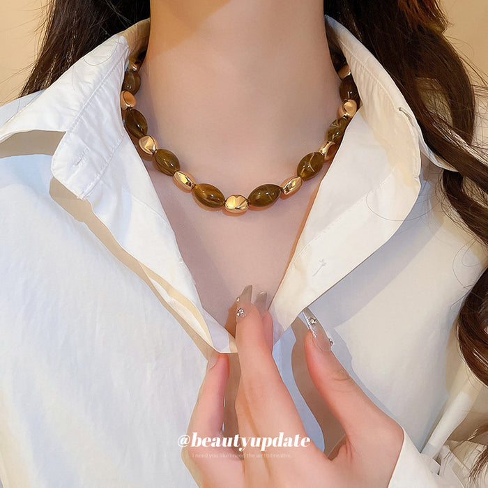 Brown Translucent Oval Bead Necklace Gold Metal Accents