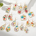 Gold Tone Geometric Pressed Flower Resin Hook Earrings view 1