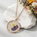 Gold Tone Round Pressed Flower Pendant Necklaces in Fourteen Designs view 11