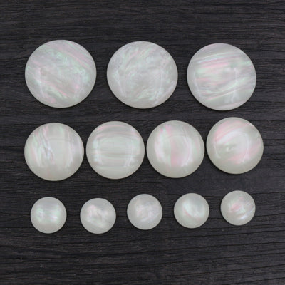 White Imitation Shell Round Resin Flatback Cabochons, grouped overview on a plain background