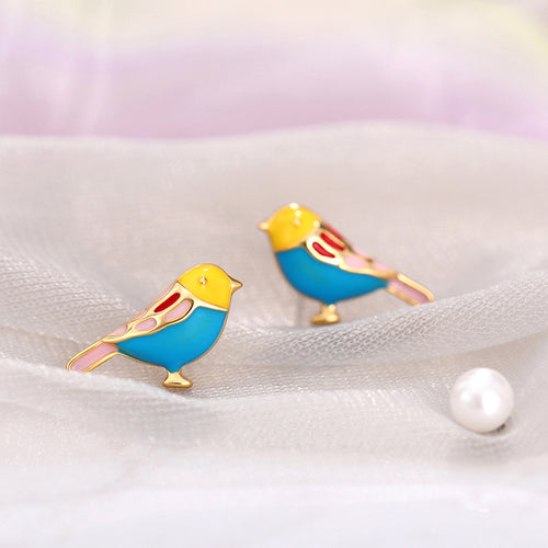Side view of gold tone colorful bird stud earrings