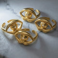 Gold Open Eye Ring Textured Band Clear Center Stone view 2