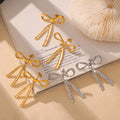 Bow Stud Earrings Dangling Split Tail Gold Steel Finish view 2
