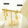 Asymmetric Liquid Drop Stud Earrings Gold And Steel Pair view 2