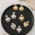 Ribbed Heart Gold and Silver Statement Stud Earrings view 1