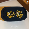 Openwork Crystal Swirl Stud Earrings With Polished Metal Tone Details view 4