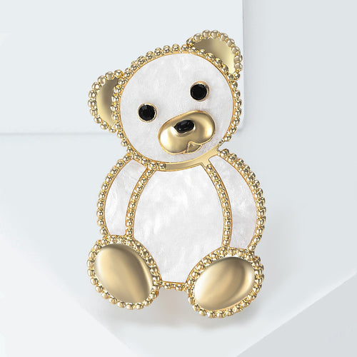 White seated teddy bear outlined in small clear crystals brooch styled display